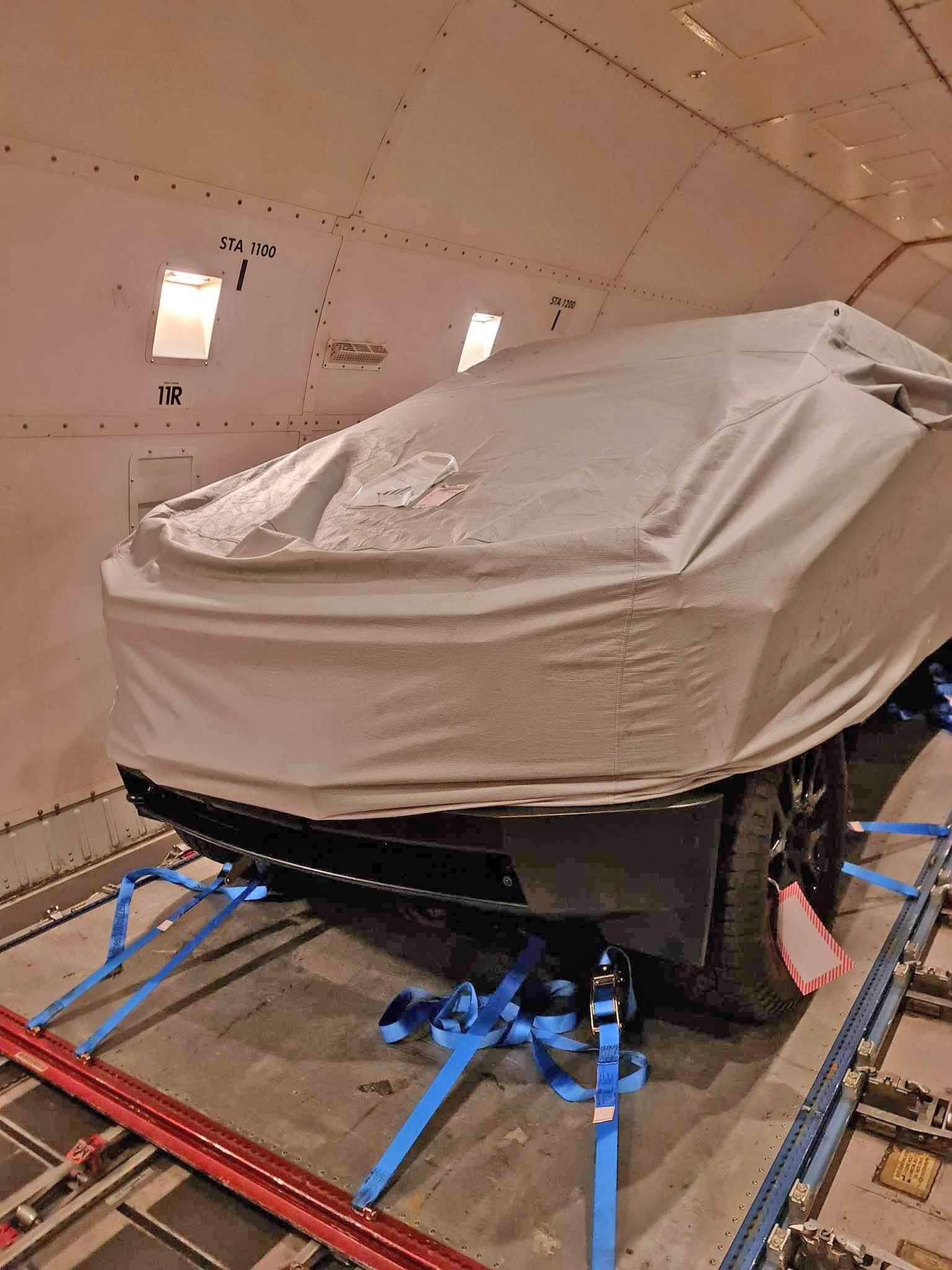 Tesla Cybertruck 2nd Cybertruck en route to winter testing (w/ no seats, no floor (battery), yoke steering wheel)! Pics on plane from Singapore ✈️ New Zealand Cybertruck transport plane to New Zealand 2