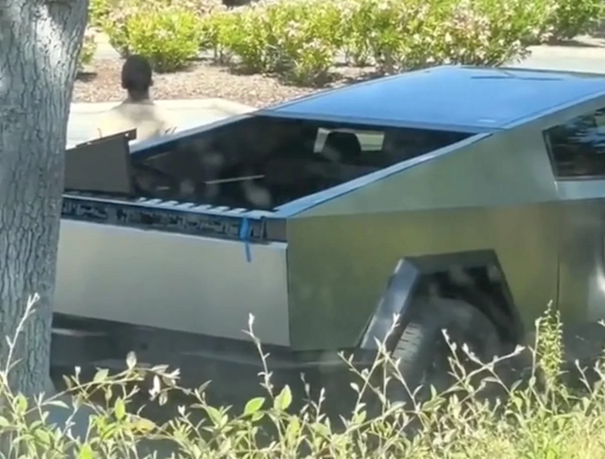 Tesla Cybertruck Cybertruck spotted with door & vault open. Tail light bar removed (new video 7/19/23) cybertruck door open vault open1