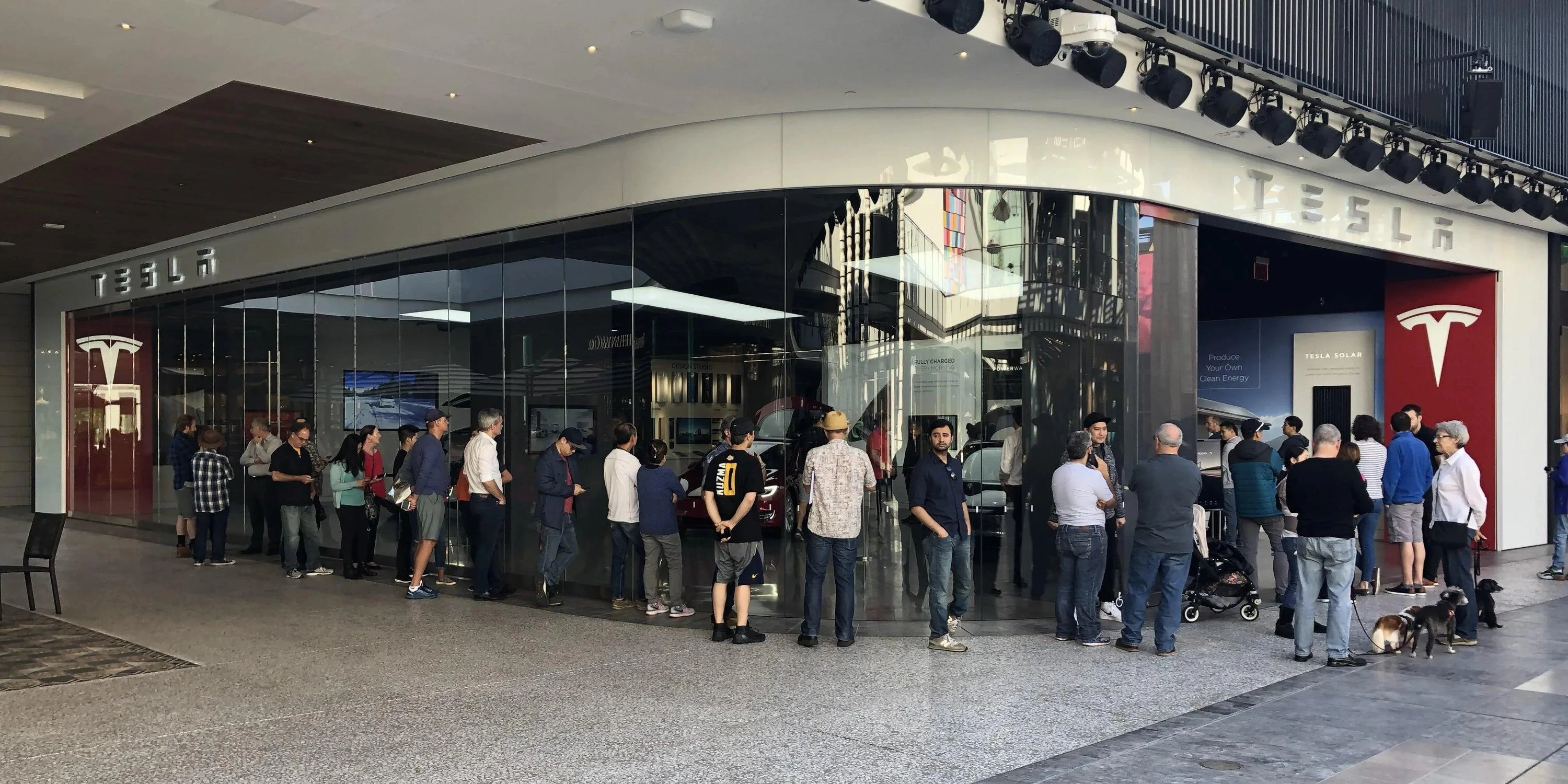 Tesla Cybertruck Can I pickup my Cybertruck at Giga Texas (factory delivery)? tesla-store-model-3-line-e1515880602563.jpg copy