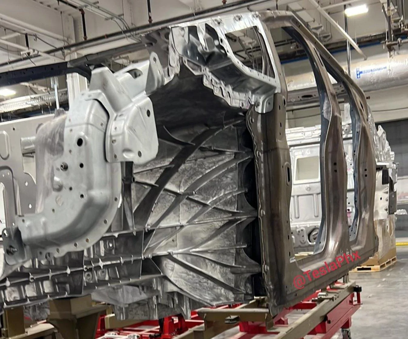 Tesla Cybertruck New Body-in-White pic shows front wheel well, front quarter window + more tesla cybertruck front wheel wells body in white BIW