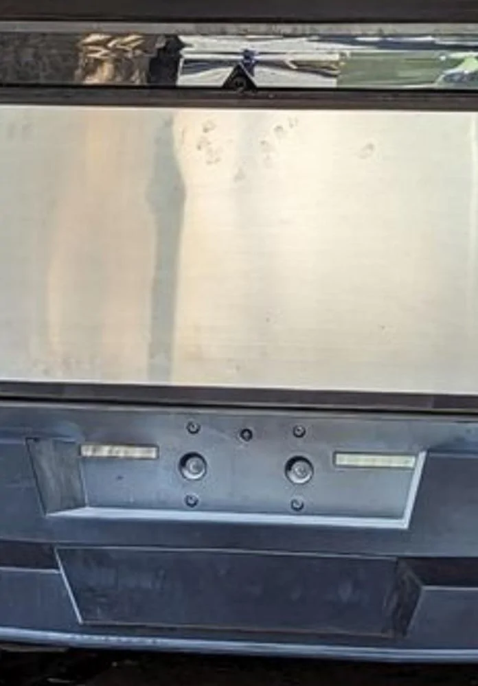 Tesla Cybertruck Cybertruck in enclosed trailer w/ folded mirrors + tire size -- video Rear cameras and license plat
