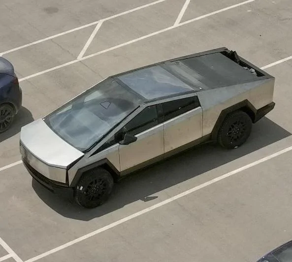 Tesla Cybertruck Photo: Frunk and Vault Bed partially open on Cybertruck (and next to Model Y) tesla cybertruck frunk vault bed