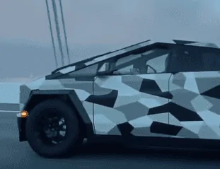 Tesla Cybertruck Camo Cybertruck looks awesome on bridge vs. regular cars + good Rivian size comparison! (8/25 video) 😍 1693229273404