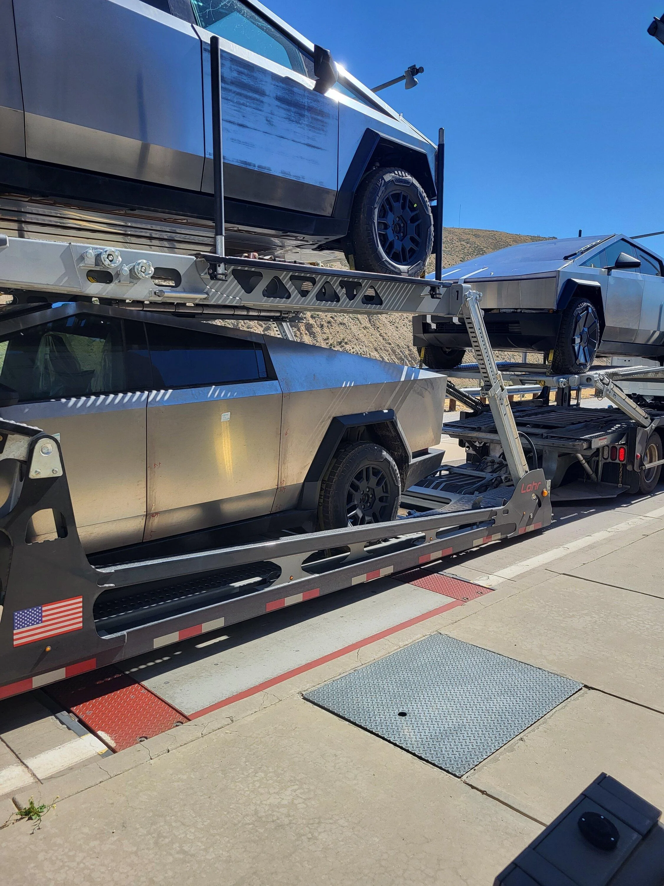 Tesla Cybertruck Fleet of Cybertrucks loading onto carriers at Giga Texas -- video from 8/26/23 IMG_7317