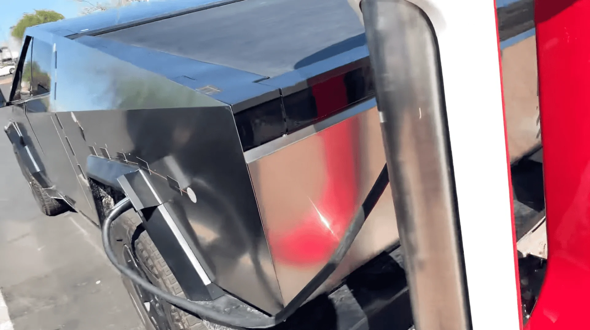 Tesla Cybertruck My Cybertruck closeups: front bumper camera & passenger door button (spotted at Tesla Service Center) Screenshot 2023-09-08 at 11.12.57 AM