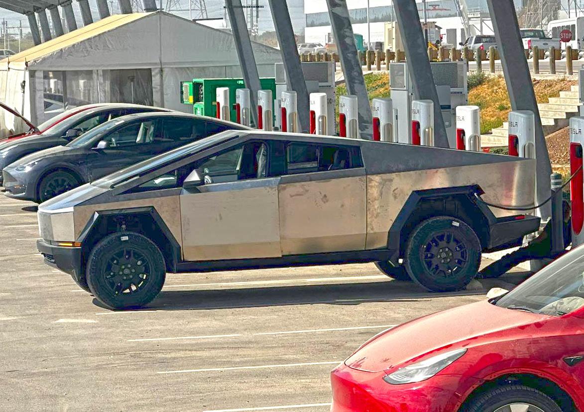 Tesla Cybertruck Cybertruck in raised suspension height supercharging at Giga Texas [9/9 pics] tesla cybertruck raised suspension supercharging 3