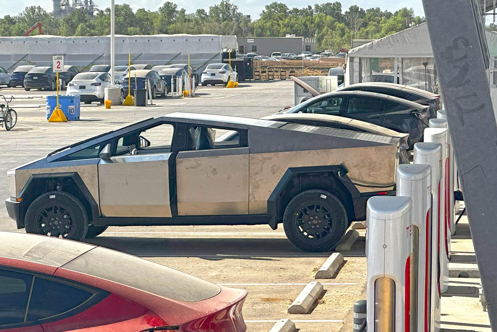 Tesla Cybertruck Cybertruck in raised suspension height supercharging at Giga Texas [9/9 pics] tesla cybertruck raised suspension superchargin
