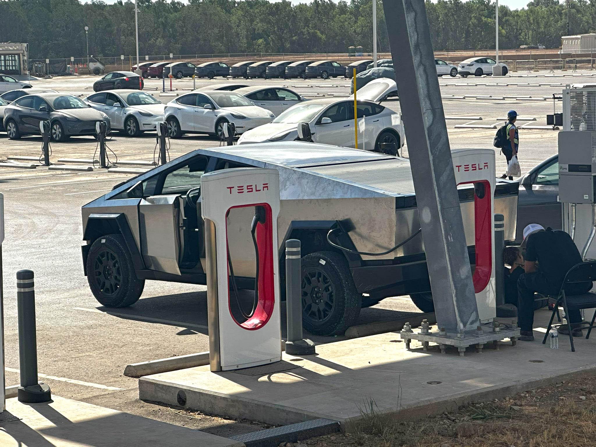 Tesla Cybertruck Cybertruck in raised suspension height supercharging at Giga Texas [9/9 pics] tesla cybertruck raised suspension supercharging 2