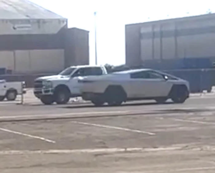 Tesla Cybertruck Cybertruck spotted in Central Valley CA, passing Dodge Ram for size comparison Screenshot 2023-09-14 at 2.07.30 PM