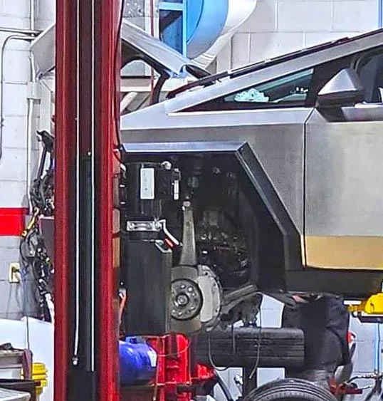 Tesla Cybertruck Cybertruck suspension & brakes exposed on a lift (photos 9/16/23) tesla cybertruck front suspension brakes