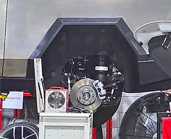 Tesla Cybertruck Cybertruck suspension & brakes exposed on a lift (photos 9/16/23) tesla cybertruck rear suspension brakes