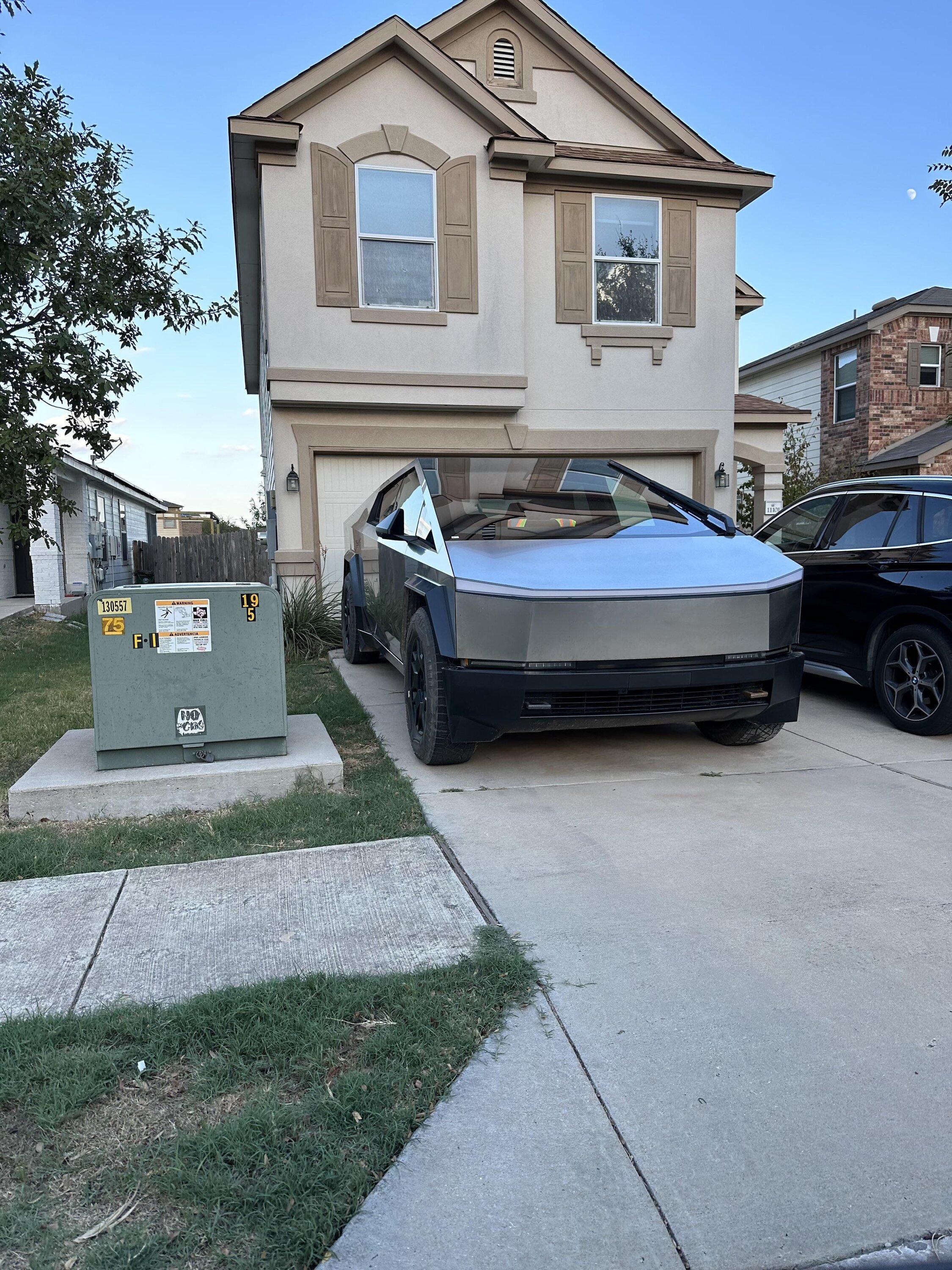 Tesla Cybertruck Cybertruck parked in (test driver's?) house driveway and showing excellent fit & finish cybertruck driveway
