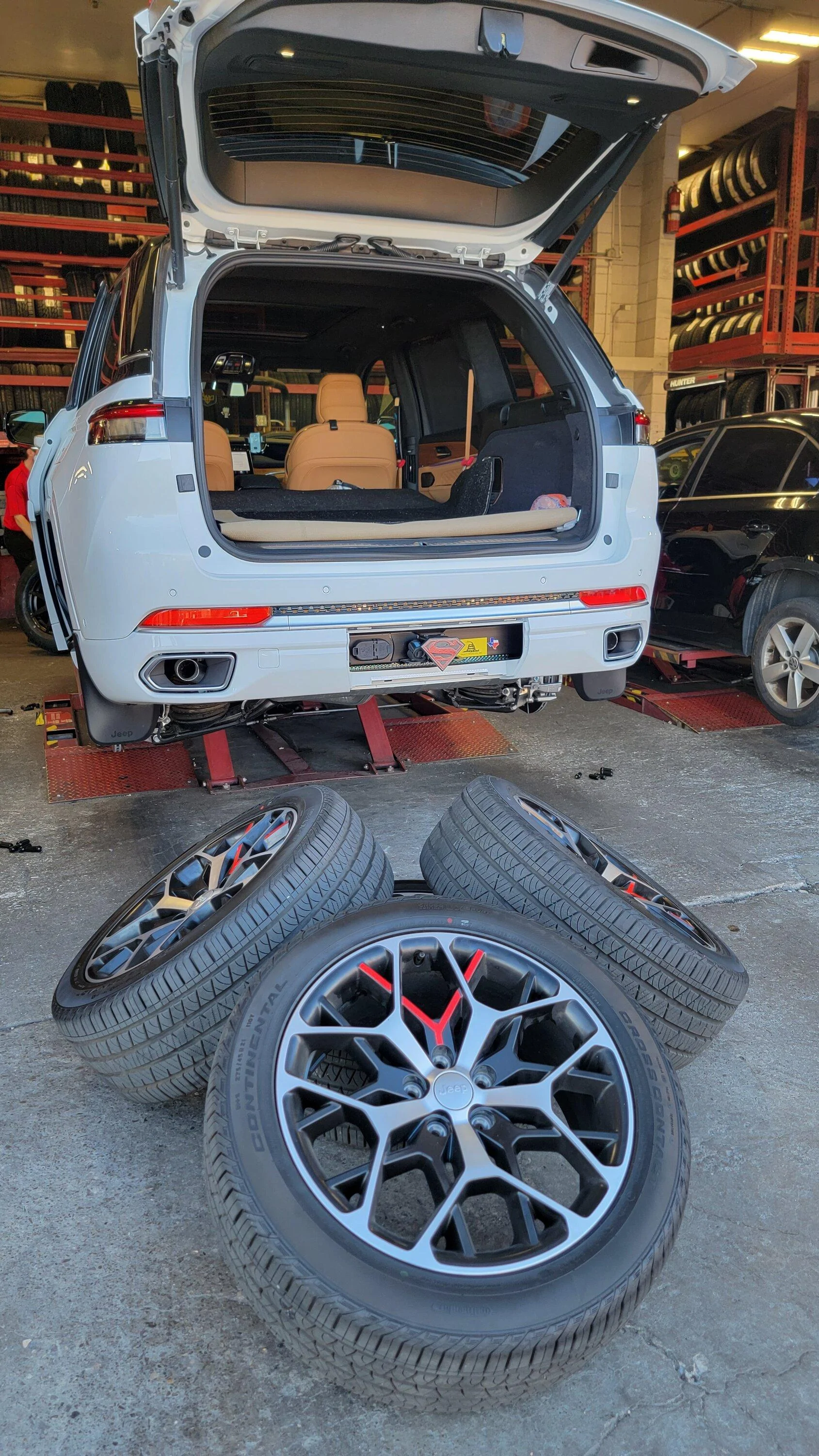 Tesla Cybertruck Cybertruck spotted carrying 8 tires in bed! @ Tesla Store in Merritt Island, FL 20230313_181854