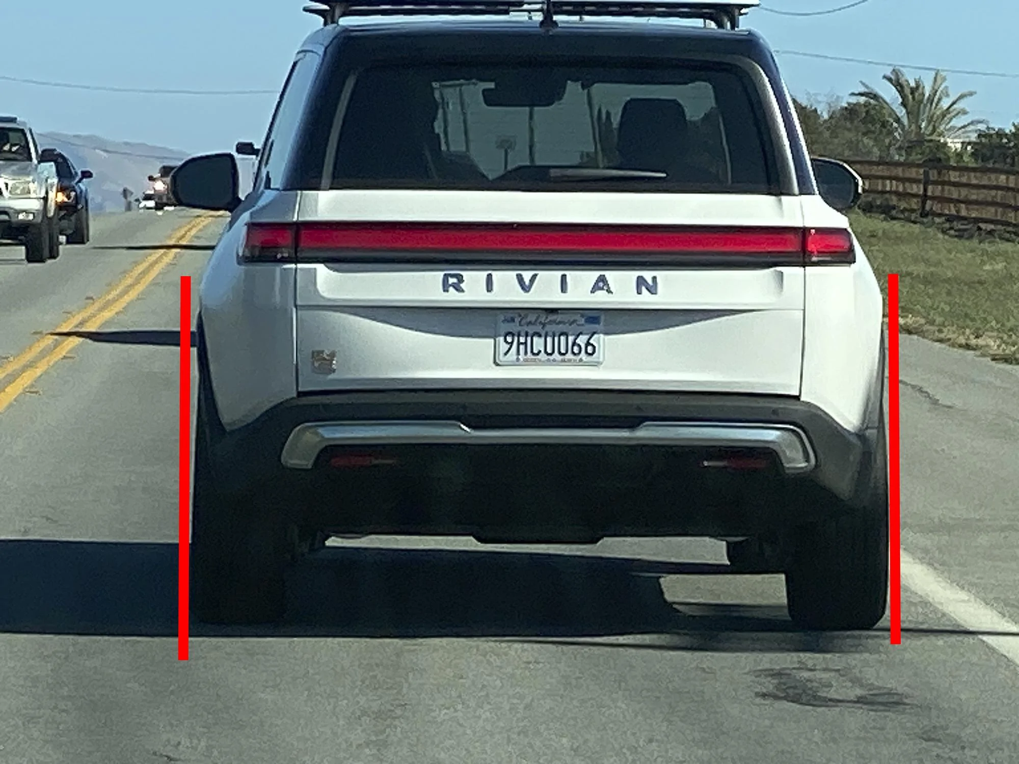 Tesla Cybertruck Cybertruck vs Rivian R1T size and design comparison -- parked next to each other Rivian tires not 90 degrees