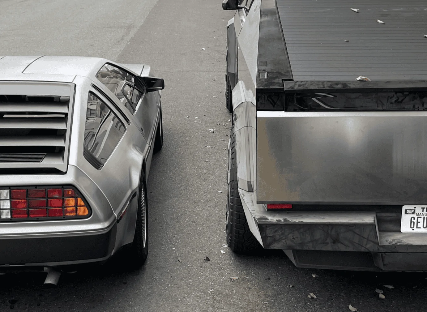 Tesla Cybertruck Cybertruck vs Rivian R1T size and design comparison -- parked next to each other 1697478636081