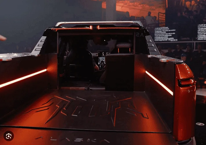 Tesla Cybertruck Video: Cybertruck tonneau cover opening, bed lighting, and tailgate dropping 1698771617342