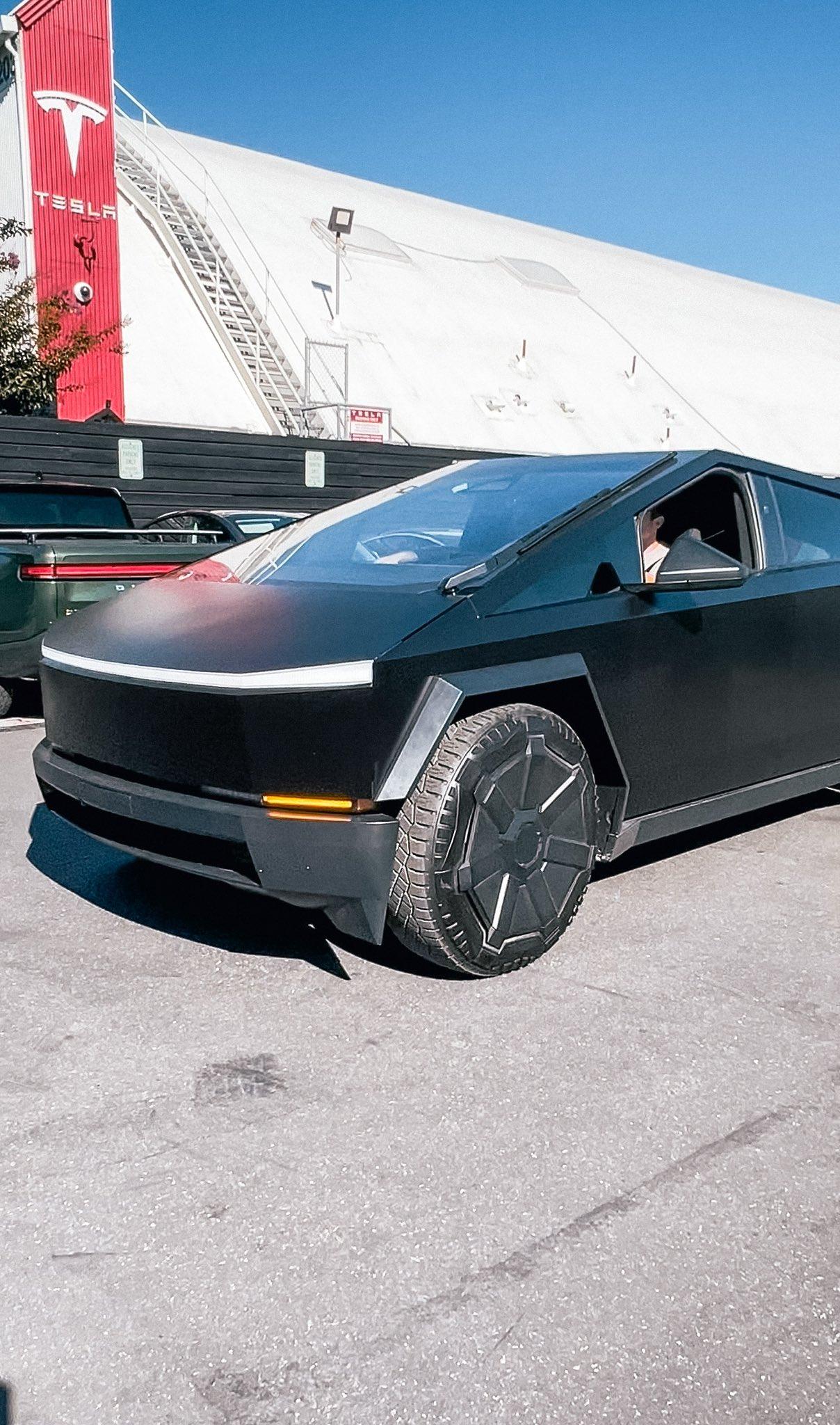 Tesla Cybertruck Matte Black Cybertruck Finally Appears!! 😱 Driven by Franz Von Holzhausen black-matte-cybertruck-design-studio4-jpe