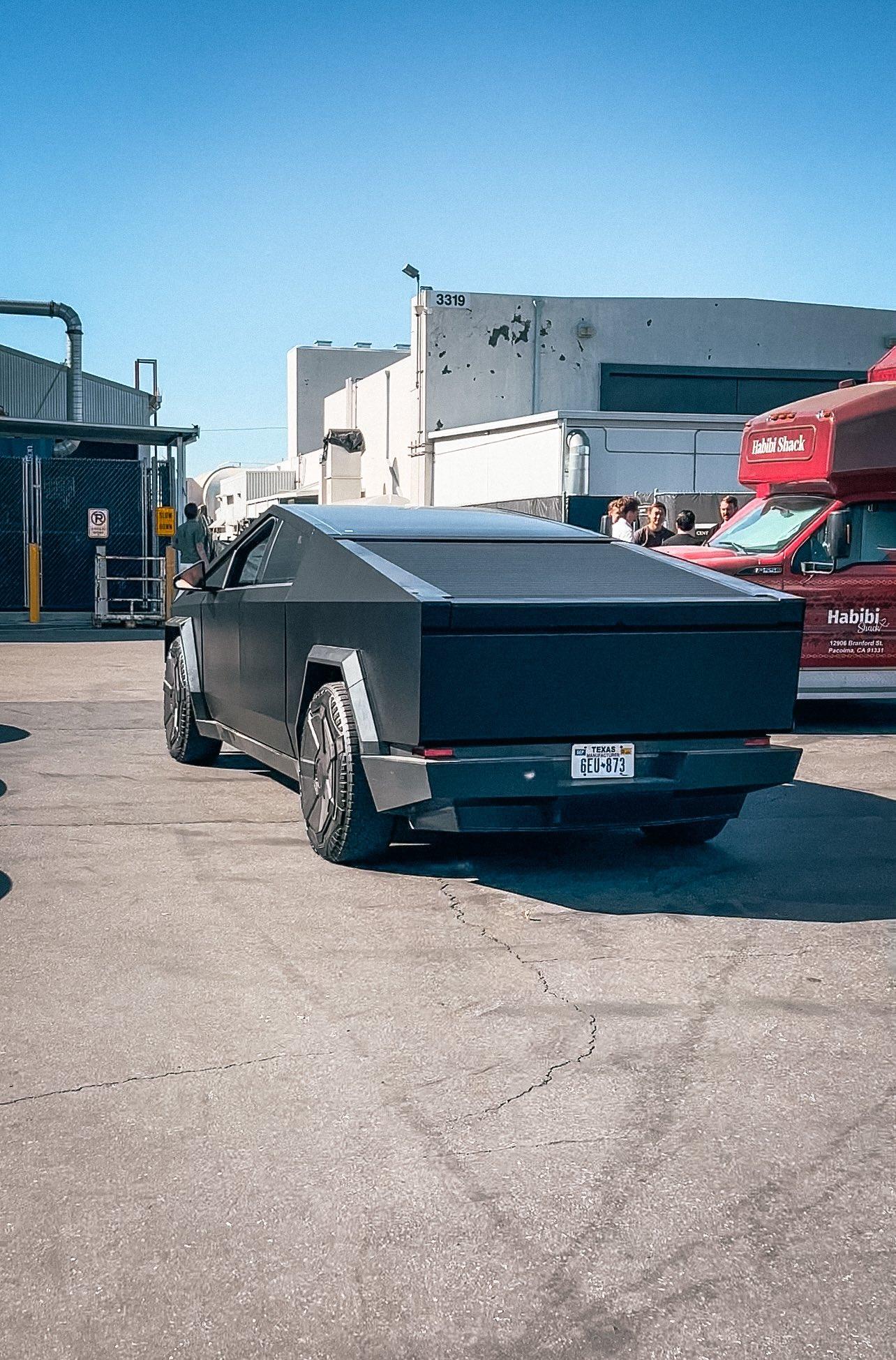 Tesla Cybertruck Matte Black Cybertruck Finally Appears!! 😱 Driven by Franz Von Holzhausen black-matte-cybertruck-design-studio2-jpe