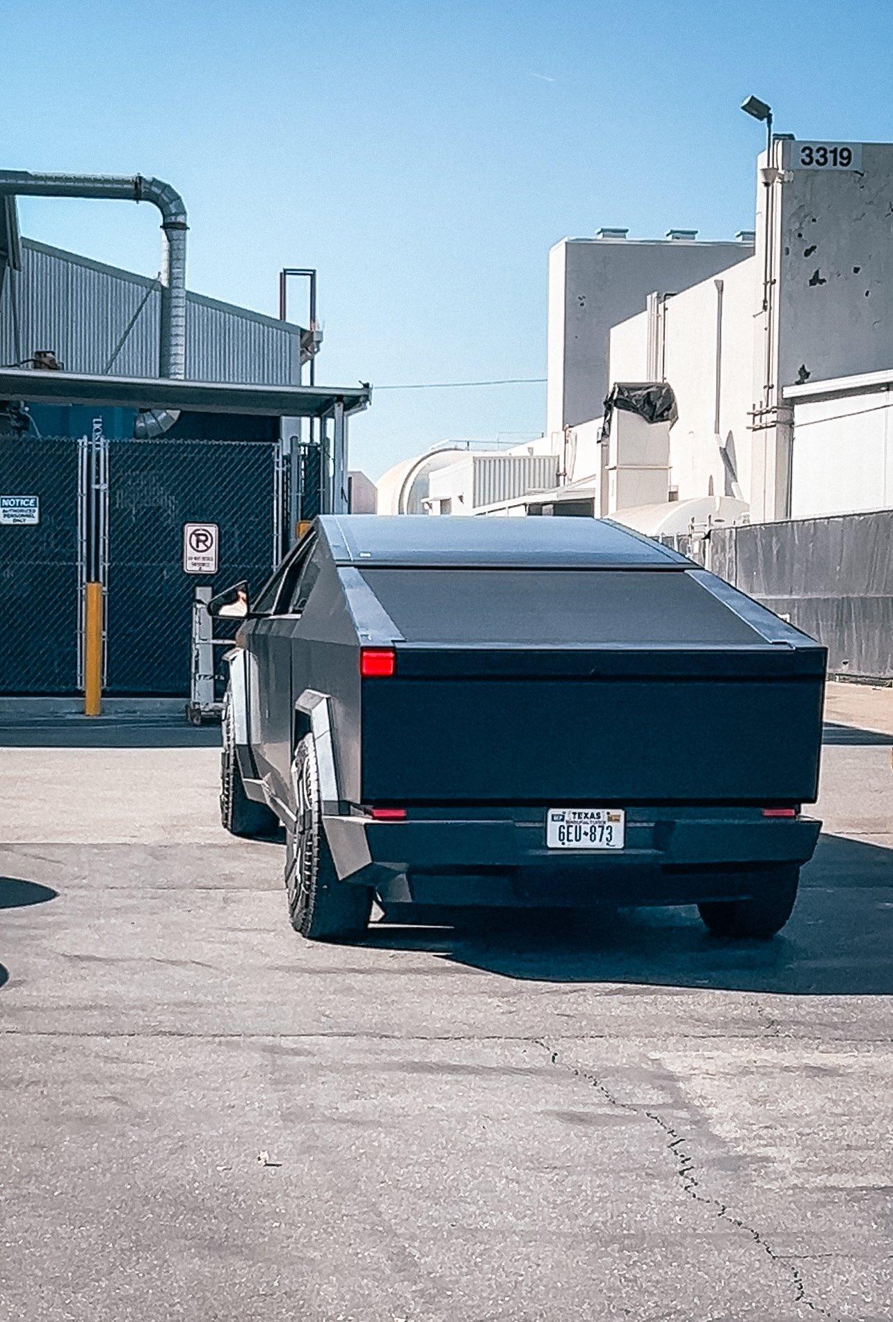 Tesla Cybertruck Matte Black Cybertruck Finally Appears!! 😱 Driven by Franz Von Holzhausen black-matte-cybertruck-design-studio1-jpe