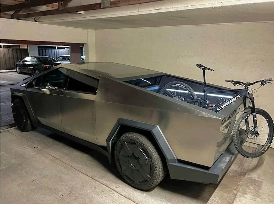 Tesla Cybertruck First inside perspective garage pic: Cybertruck parked w/ bed lighting on and bike in bed cybertruckparkedgarag