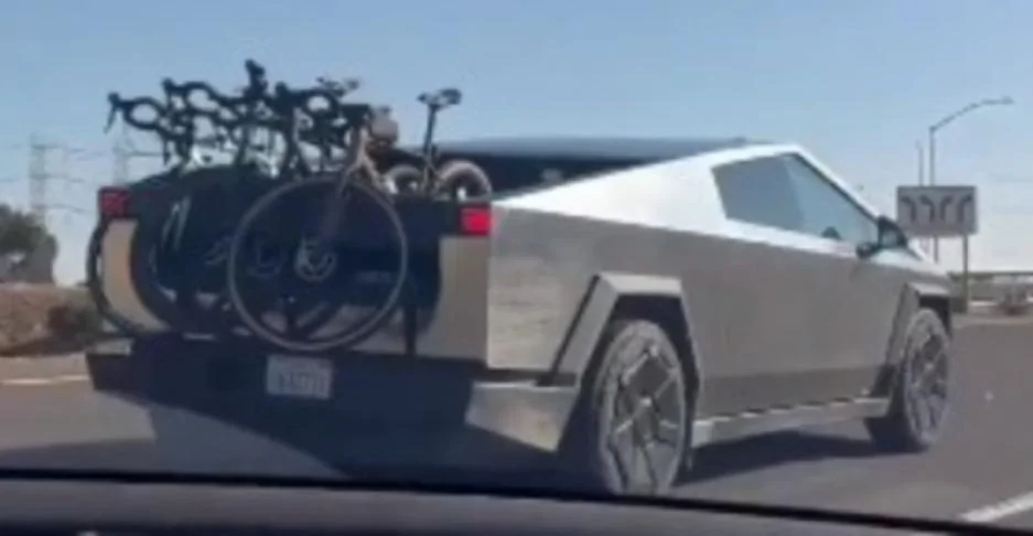 Tesla Cybertruck First inside perspective garage pic: Cybertruck parked w/ bed lighting on and bike in bed WF4JgO3