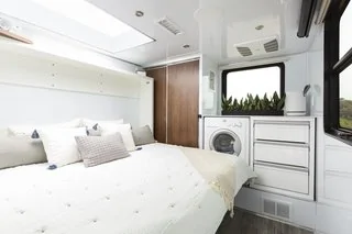 Tesla Cybertruck These Off-Grid, Luxury Travel Trailers Pack Enough Oomph to Power a Tesla Cybertruck awer-dresser-and-a-blackout-shade-for-the-skylight