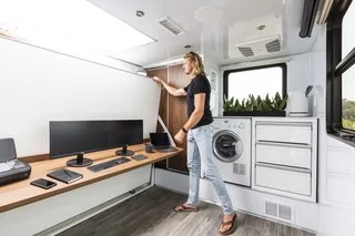 Tesla Cybertruck These Off-Grid, Luxury Travel Trailers Pack Enough Oomph to Power a Tesla Cybertruck n-80-inch-long-walnut-desk-surface-and-white-board