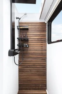 Tesla Cybertruck These Off-Grid, Luxury Travel Trailers Pack Enough Oomph to Power a Tesla Cybertruck oilet-towel-warmer-outdoor-shower-and-a-shower-sea