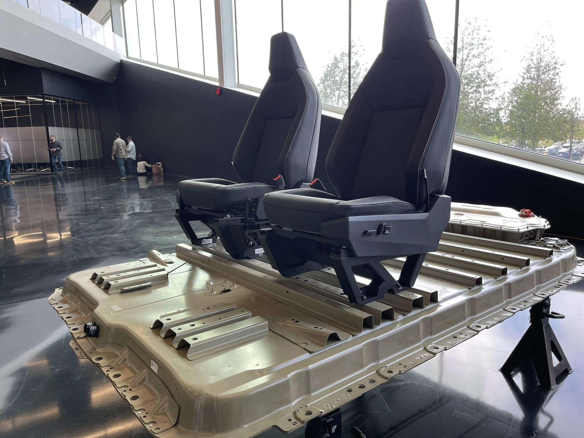 Tesla Cybertruck If There Is No Middle Front Seat Option, Might Tesla Offer It Later?  Can One Be Added Aftermarket? tesla-cybertruck-battery-seats