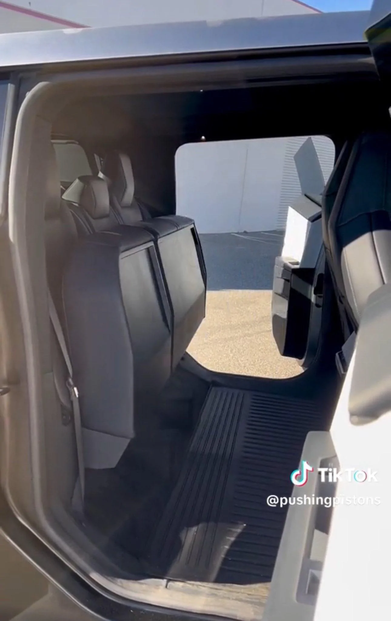 cybertruck storage space back seats folded up.jpeg