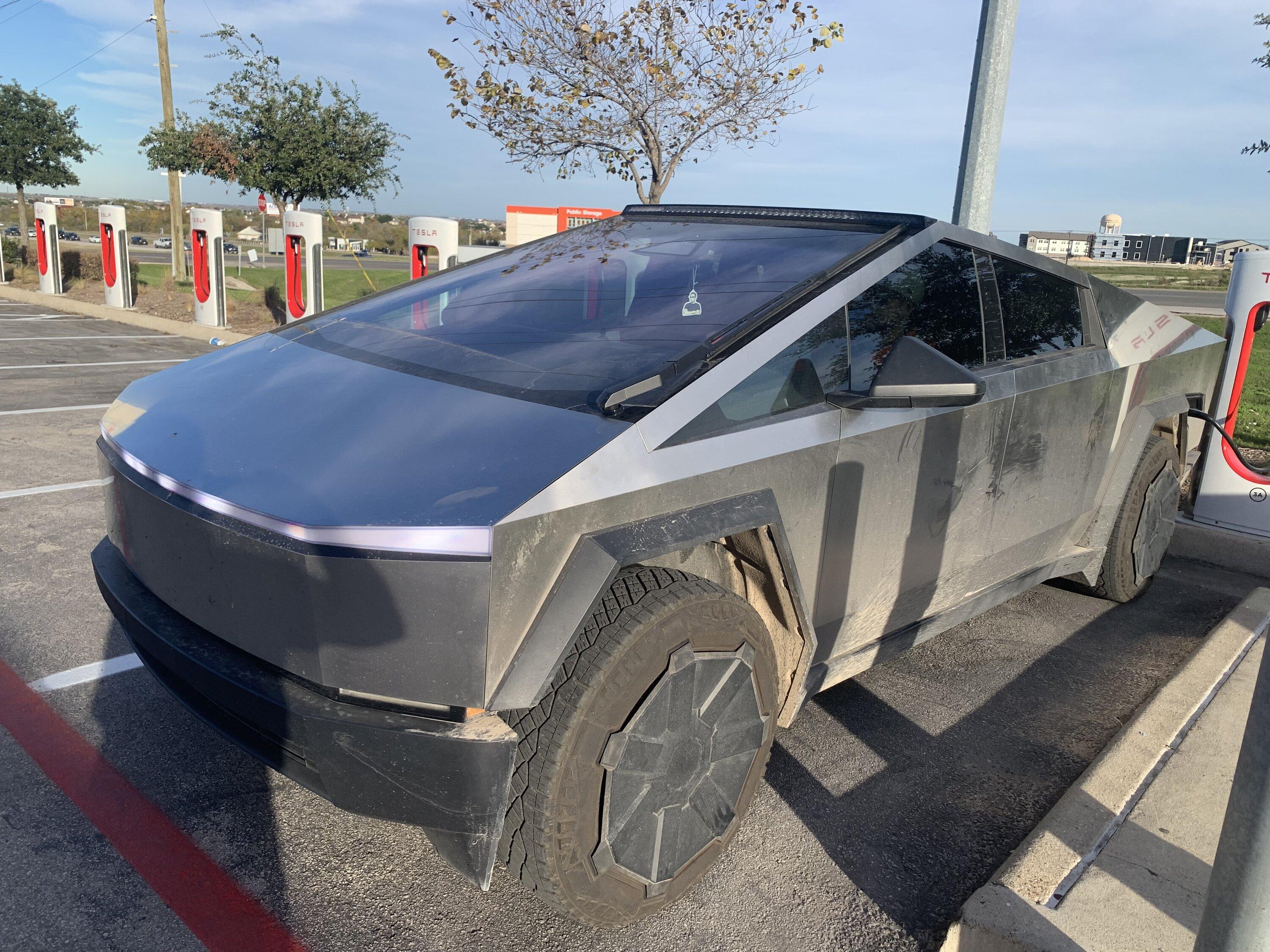 Tesla Cybertruck Cybertruck with LED light bar and in high suspension mode spotted at charging station IMG_0625