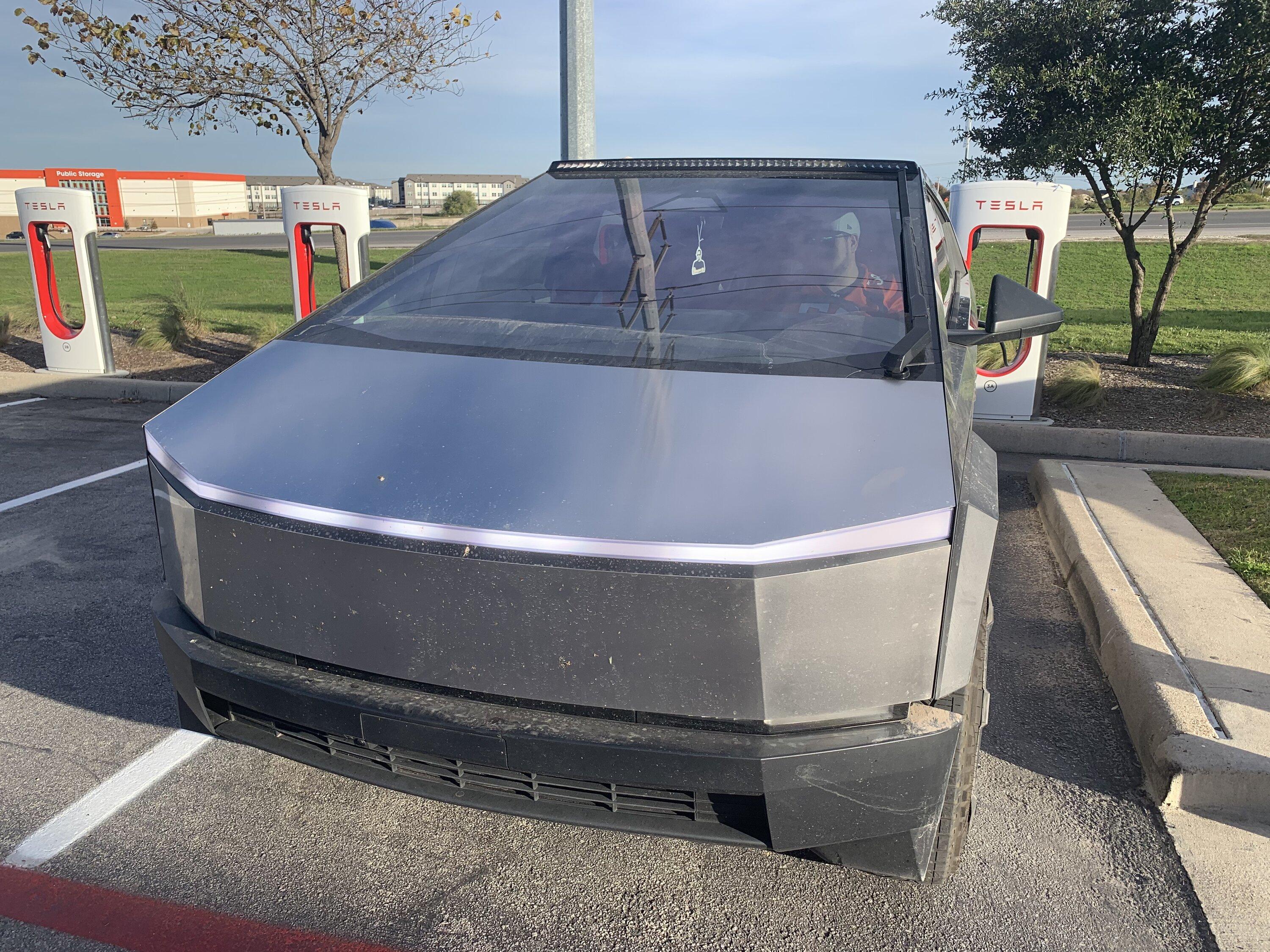Tesla Cybertruck Cybertruck with LED light bar and in high suspension mode spotted at charging station img_0626-jpe