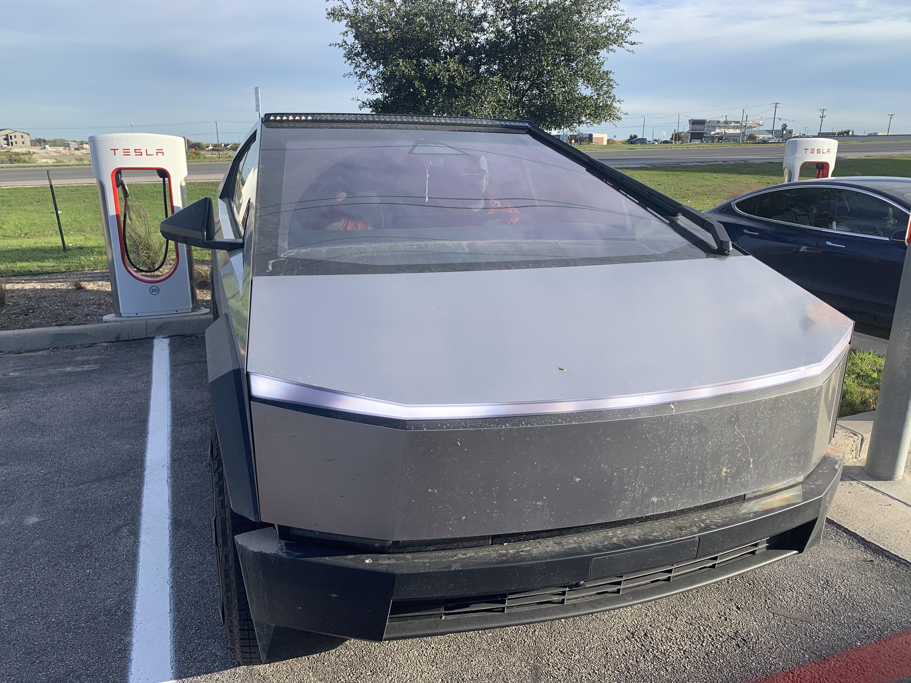 Tesla Cybertruck Cybertruck with LED light bar and in high suspension mode spotted at charging station img_0627-jpe