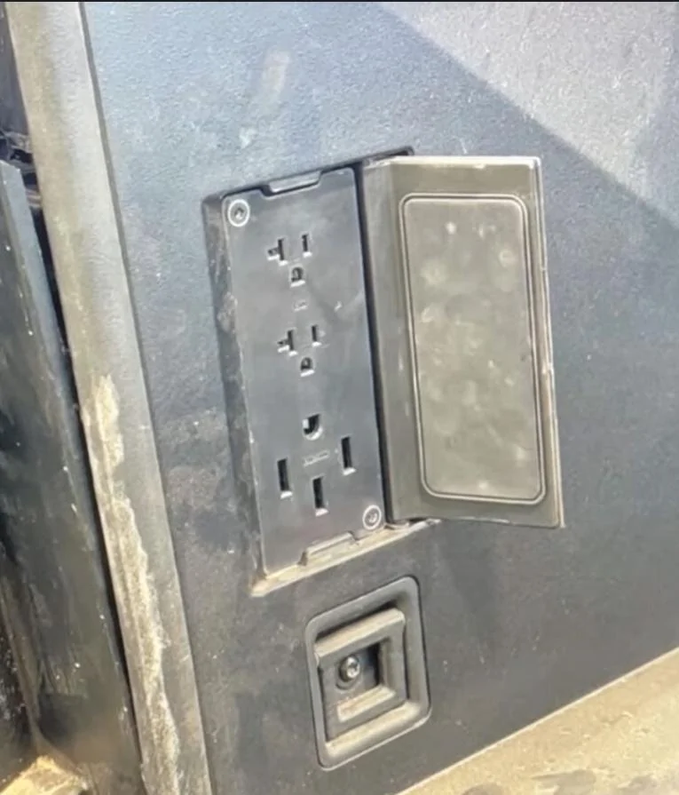 Tesla Cybertruck Rear Seat 120v Outlet (and Console) -- Photo Screenshot_20231219_163607_Googl