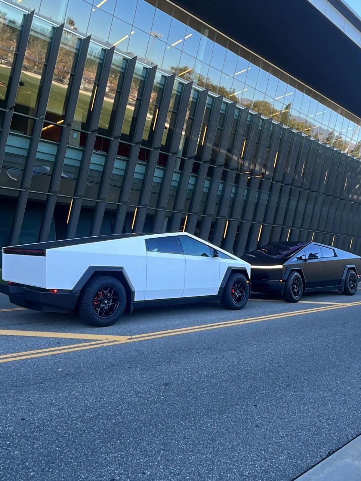Satin White Cybertruck vs. Satin Black Cybertruck.jpeg