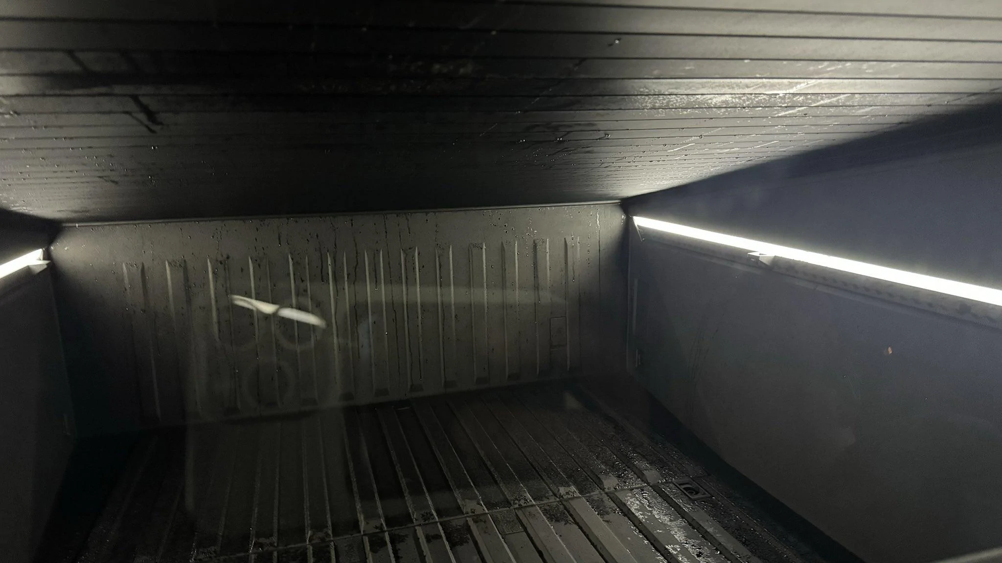 cybertruck bed tonneau vault leak water rain.jpeg
