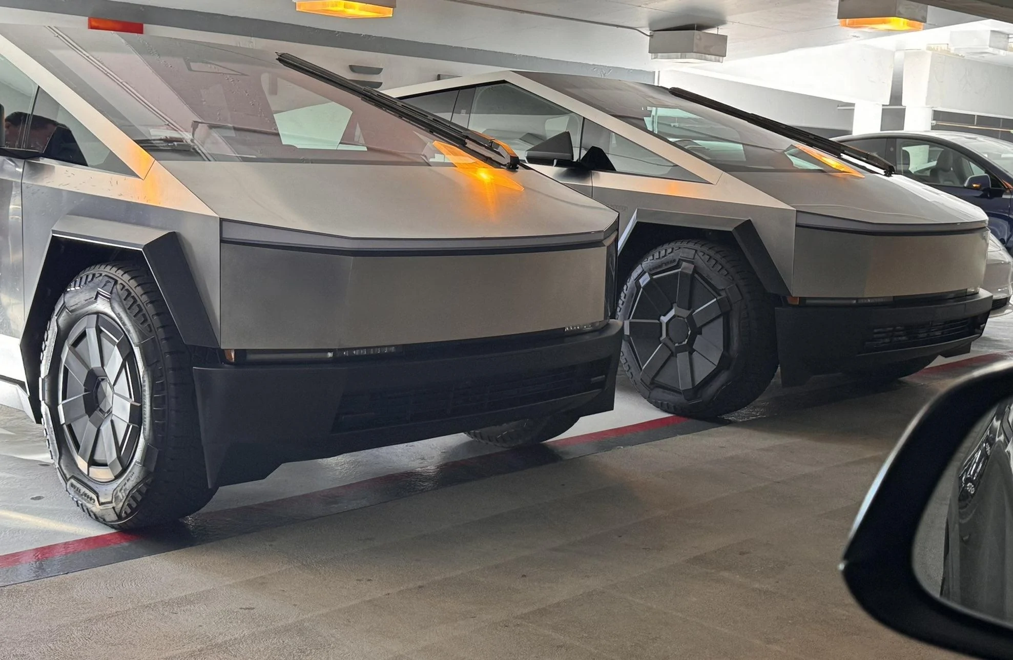 Tesla Cybertruck Small Aero Wheel Covers spotted & compared (to larger covers)! Cybertruck small smaller wheel caps covers 2