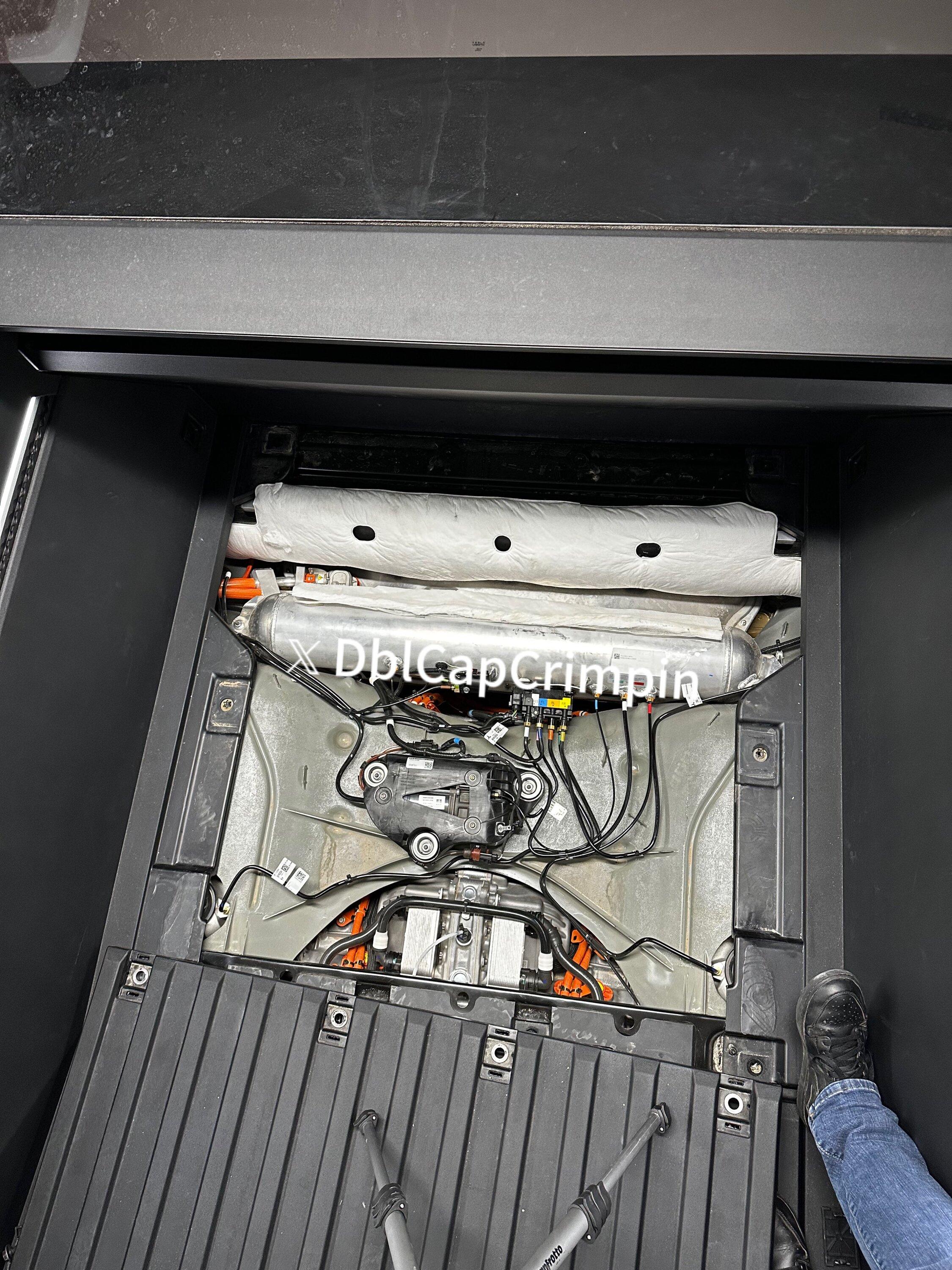 Tesla Cybertruck Photo: Why no spare tire in Cybertruck -- what's under bed floor GD3Zd4QW4AAziTO