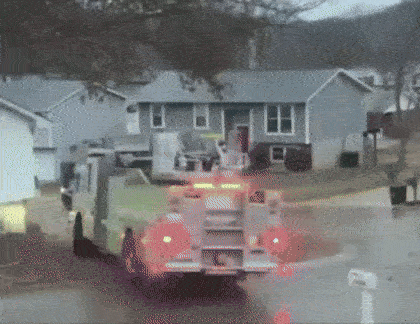 Tesla Cybertruck CT stuck on snowy driveway firetruck2-ezgif.com-optimize
