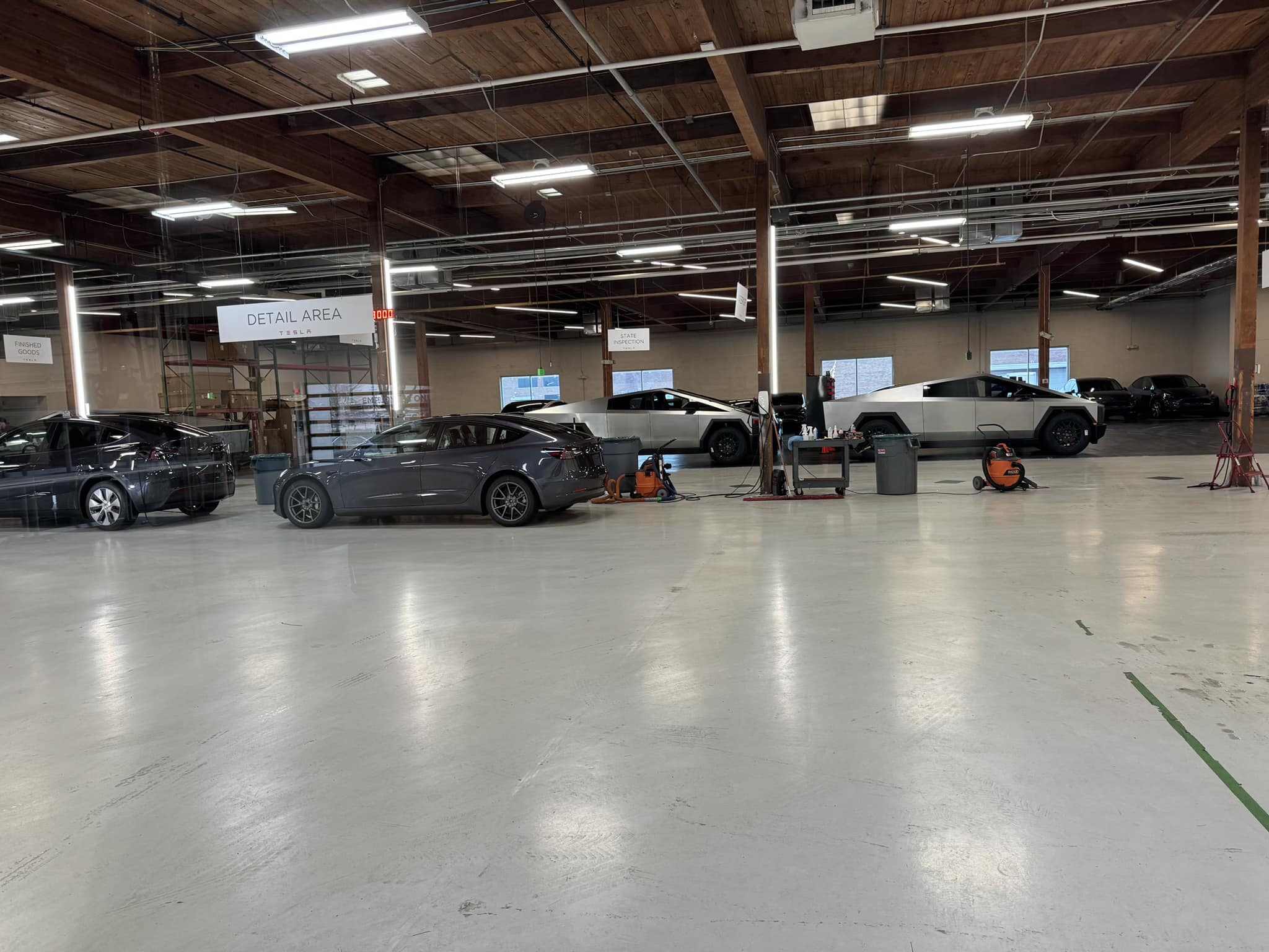 Tesla Cybertruck 9 Cybertrucks being prepared for delivery at Dallas Texas Tesla Center dallas texas cybertrucks