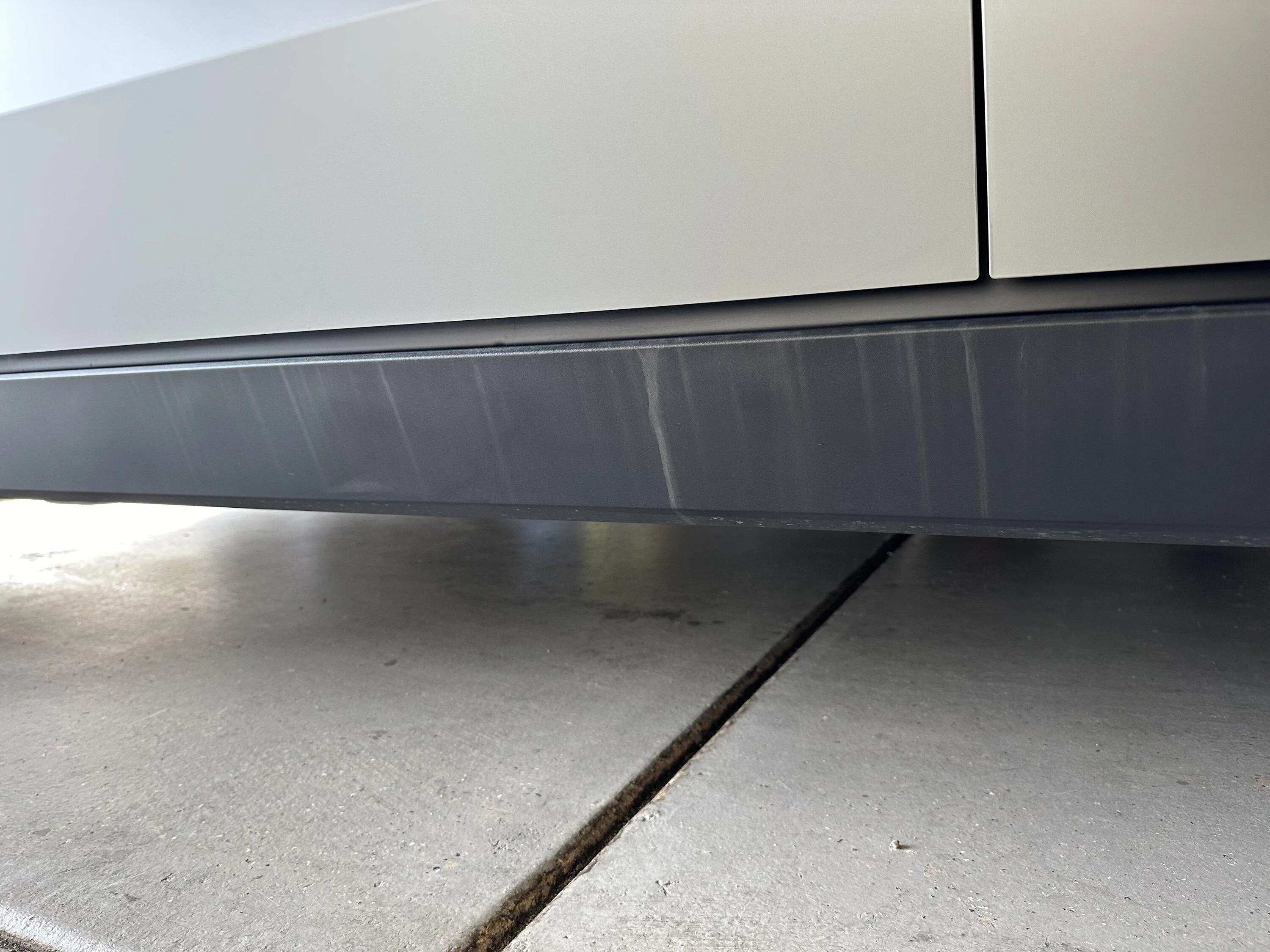 Tesla Cybertruck First service appointment completed: tailgate lightbar cracked glass & stained running boards IMG_5543