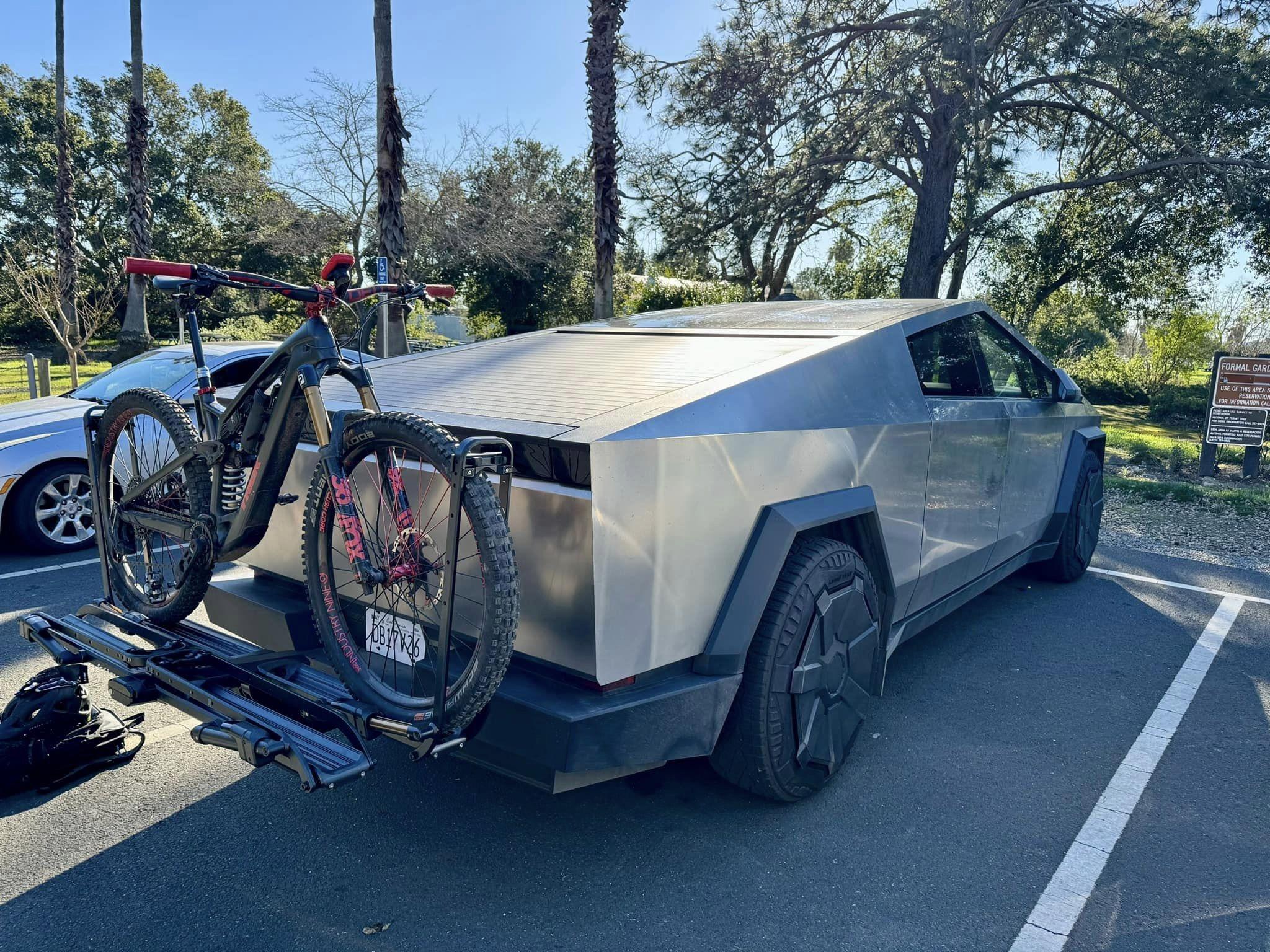 Tesla Cybertruck Kuat Bike Hitch Rack installed photos + mountain bike fully fit laying down in bed Cybertruck bike hitch rack Kuat 2