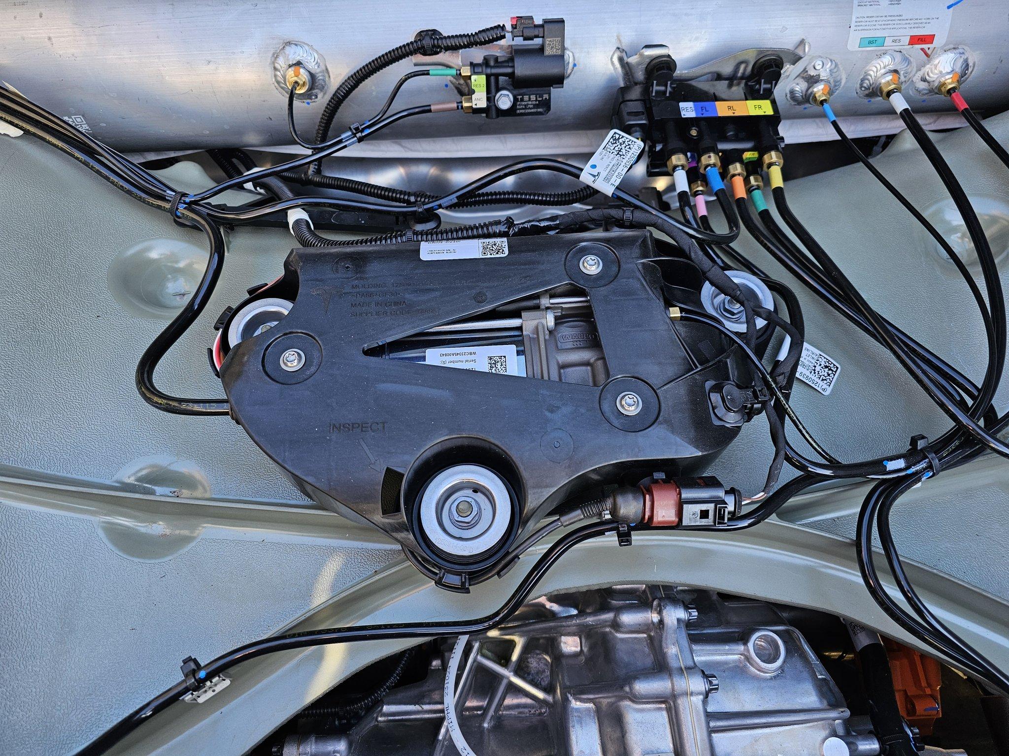 Tesla Cybertruck Air Suspension Pump / Reservoir Tank location below the Cybertruck bed floor (photos) cybertruck air suspension underneath bed floor 4