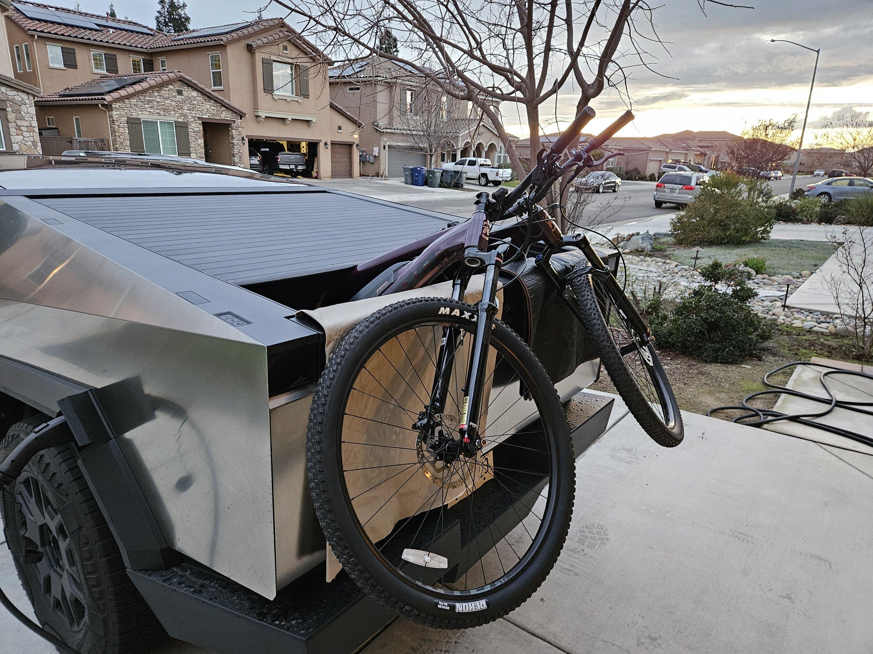 Tesla Cybertruck Anyone transport e-bikes in bed vs on rack/hitch in their CT? 20240202_173145