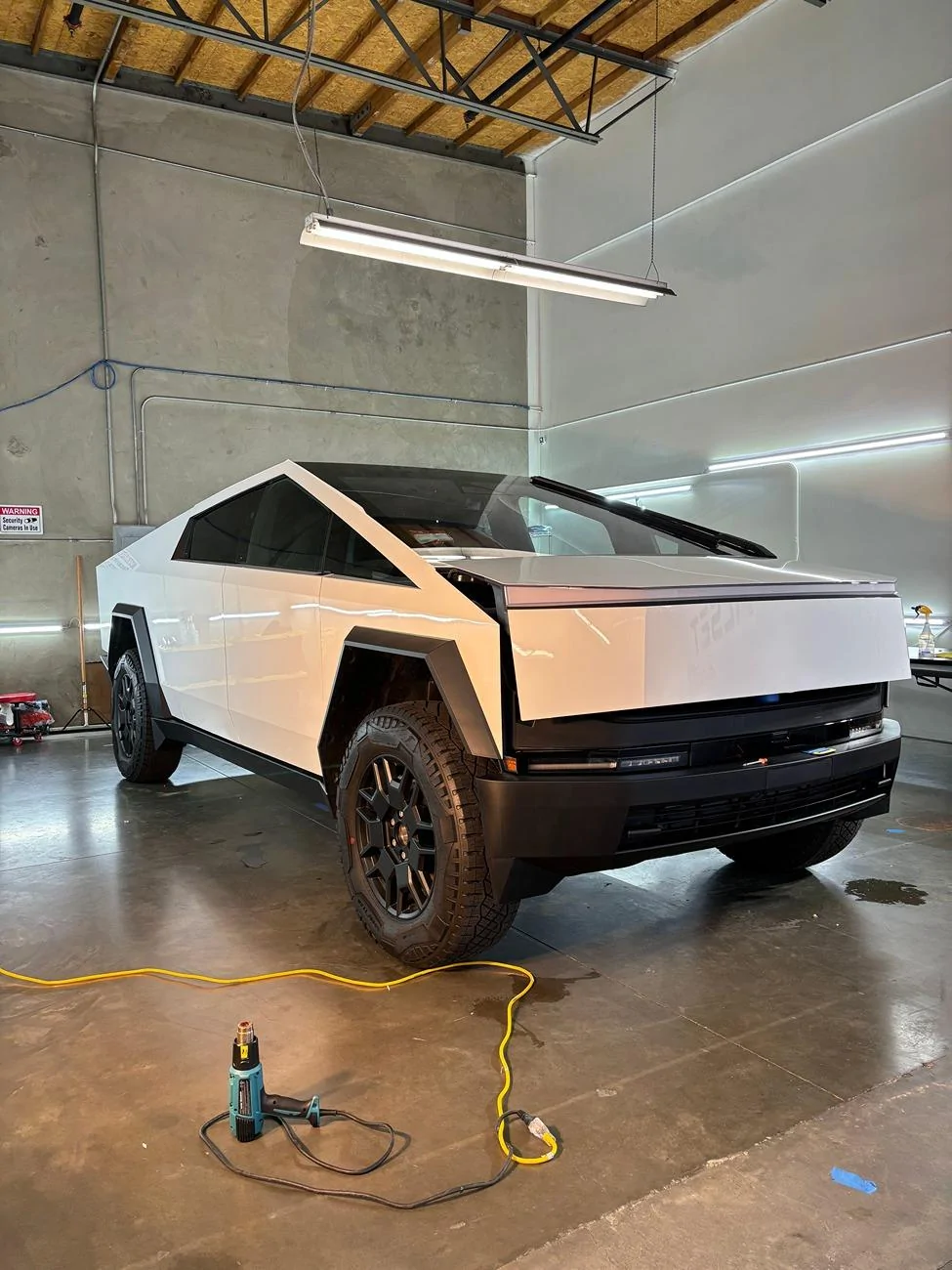 Tesla Cybertruck This Cybertruck in Gloss White PPF would fit in at a Tuxedo Event (Photos) IMG_0834