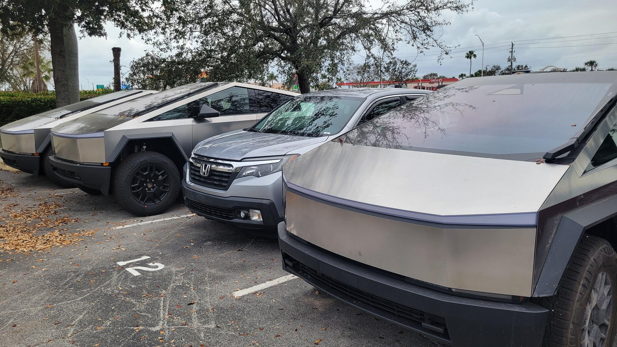Tesla Cybertruck 3 Cybertrucks compared to my Ridgeline @ Fort Myers, FL - Service Center 20240302_142242