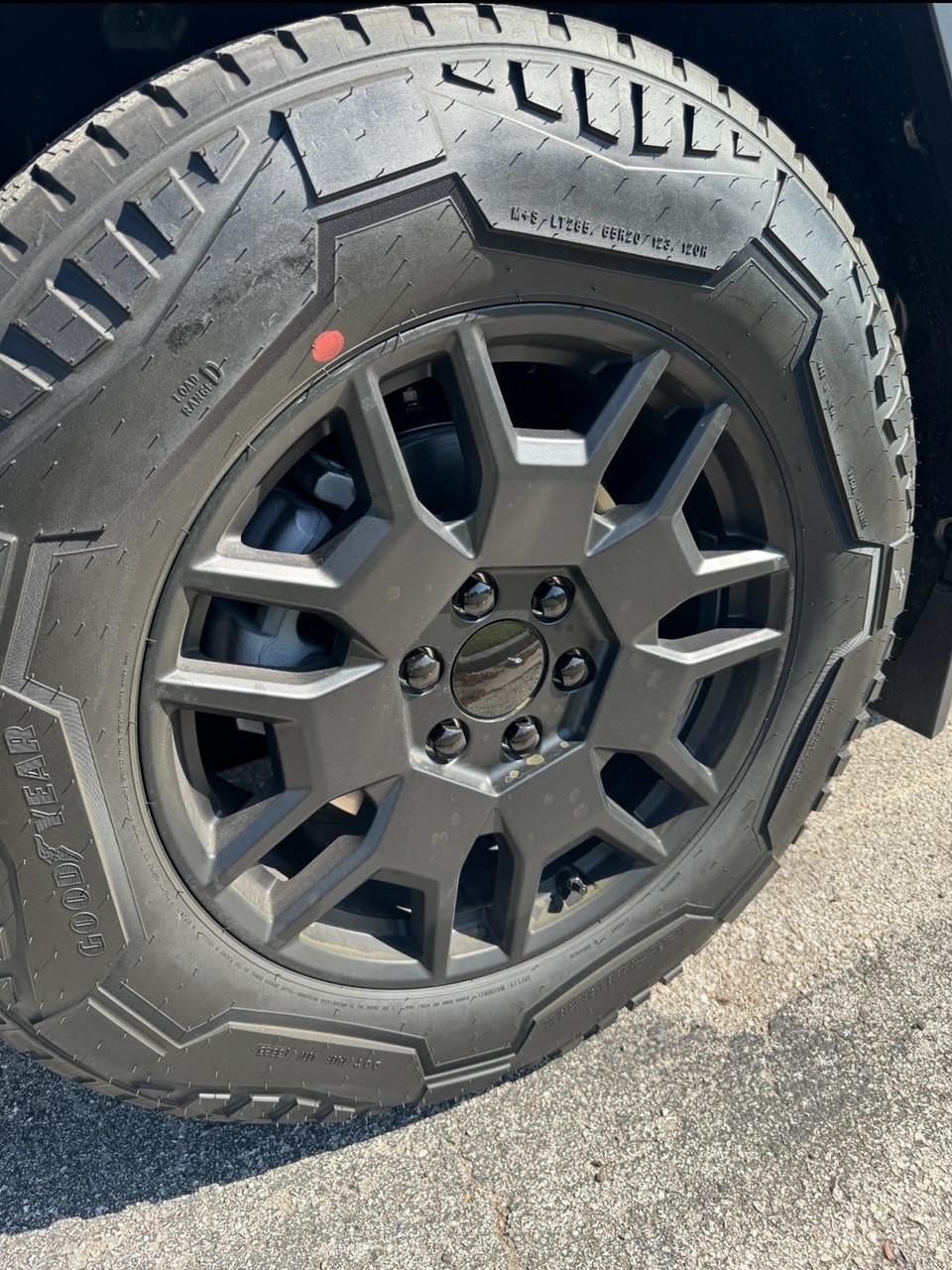 Tesla Cybertruck Accessories installed: Molle Vault Cargo Divider + Vault Cargo Bins (Dimensions Inside) + Wheel Center Caps Cybertruck Wheels With Partial Wheel Covers