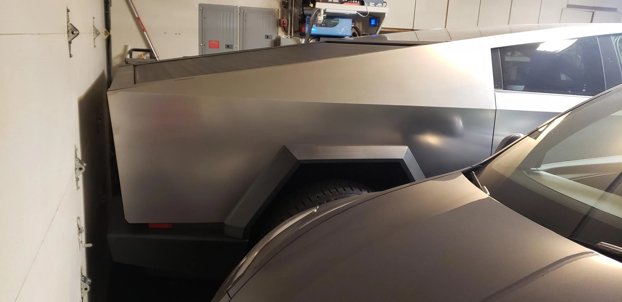Tesla Cybertruck Cybertruck doesn't quite fit in my standard garage. Yours? Tight fit 1