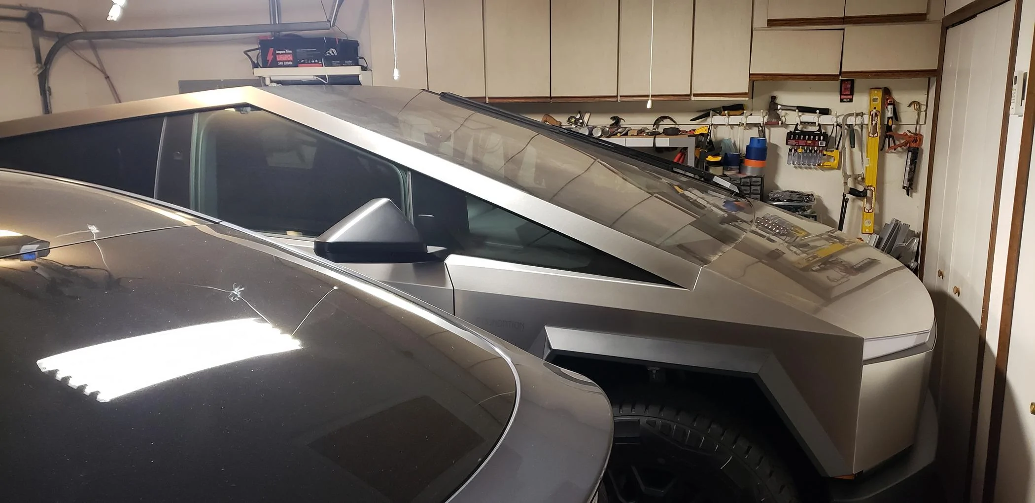Tesla Cybertruck Cybertruck doesn't quite fit in my standard garage. Yours? Tight fit 2