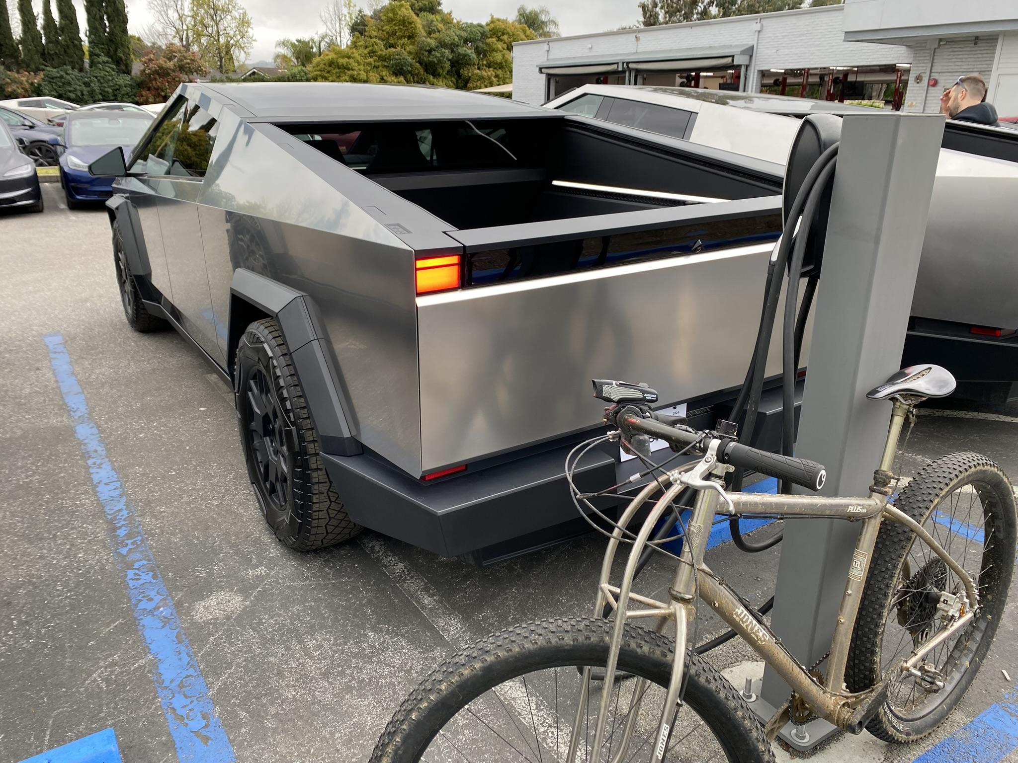 Tesla Cybertruck 12/8 CyberBeast waiting room 240327_06 back with Bike.JPEG